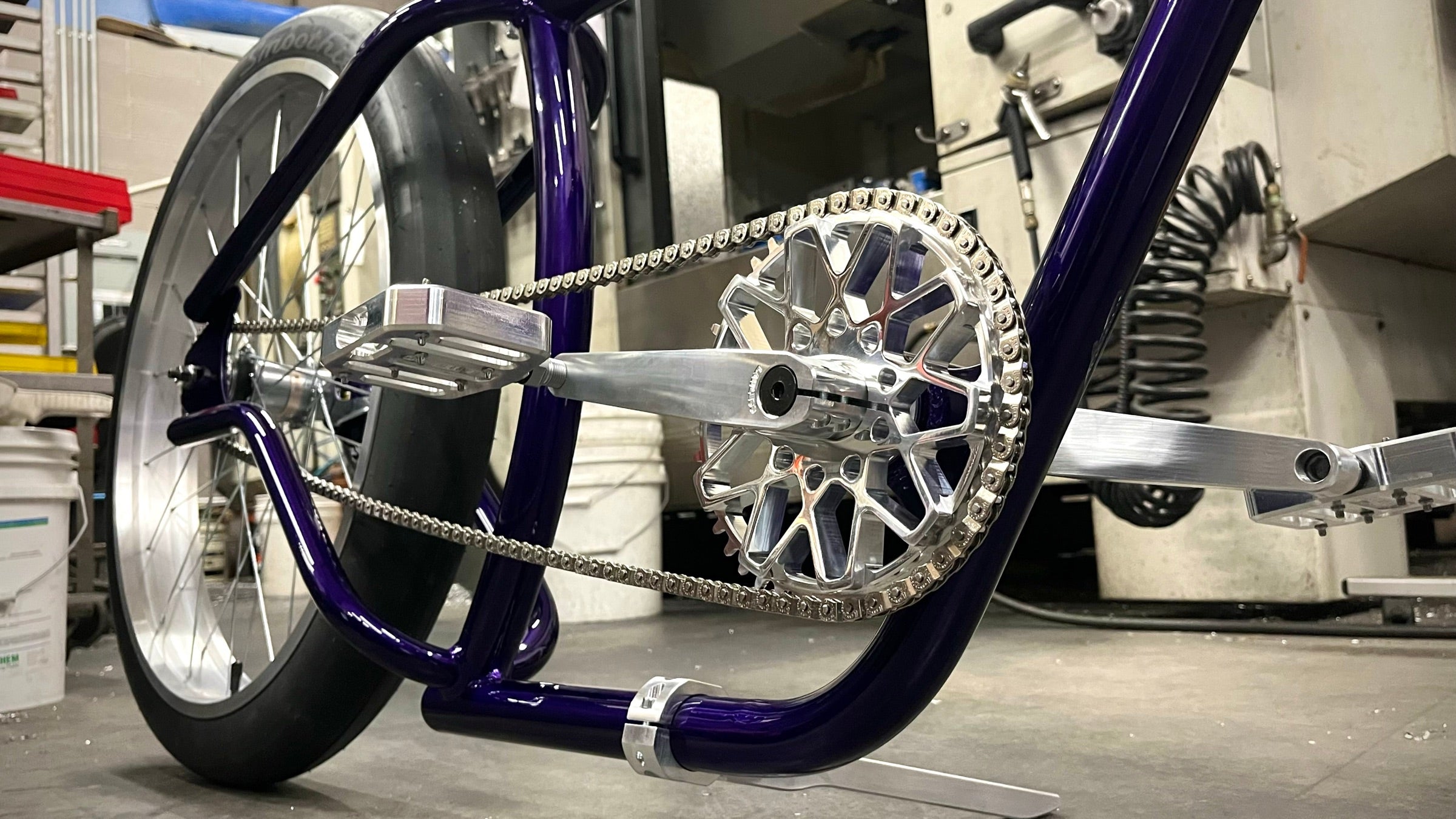 Purple Lawless custom cruiser with billet aluminum drivetrain in the Mesa shop